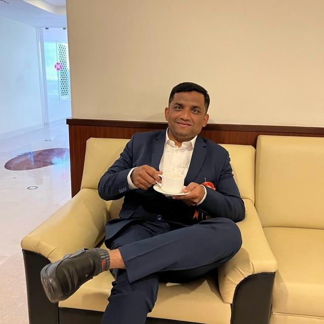 Adv. Munavvar Sayyed in formal attire